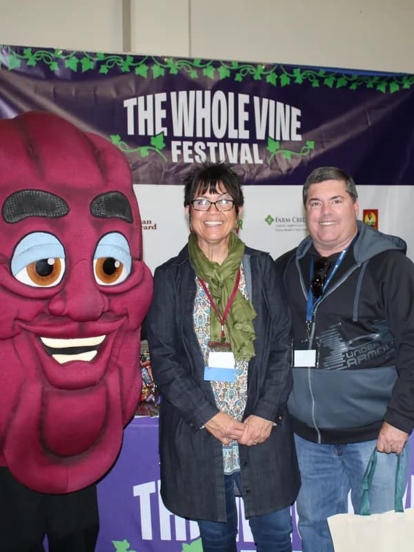 Attendees with the Tree & Vine Expo mascot